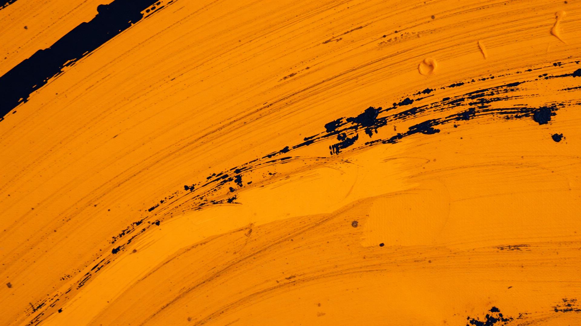 Macro detail of oil painting brushstrokes in ochre and ink